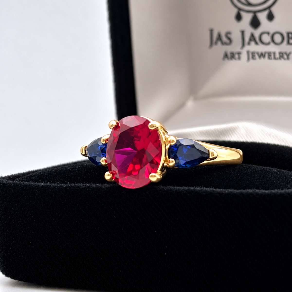4.5ctw Oval Ruby & Blue Sapphire Three-Stone Statement Ring