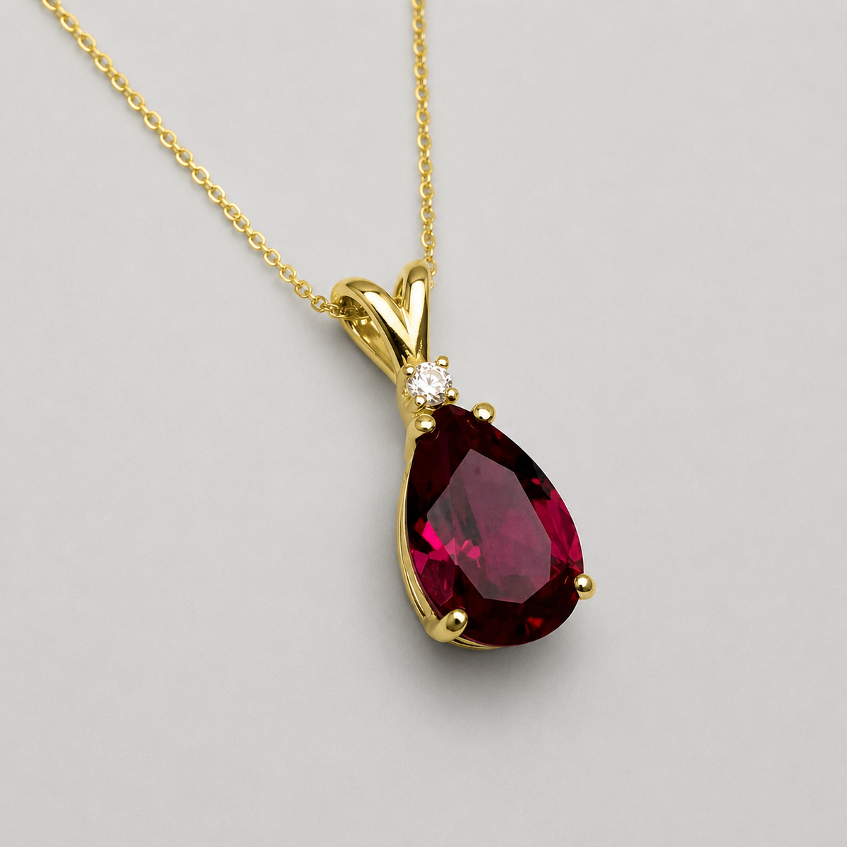 7.5ct Pear Cut Ruby Pendant Necklace with White Sapphire Accent