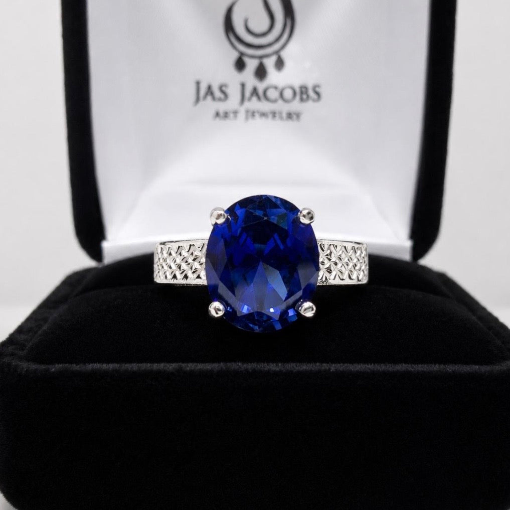 12x10 Blue Sapp Solitaire carved band