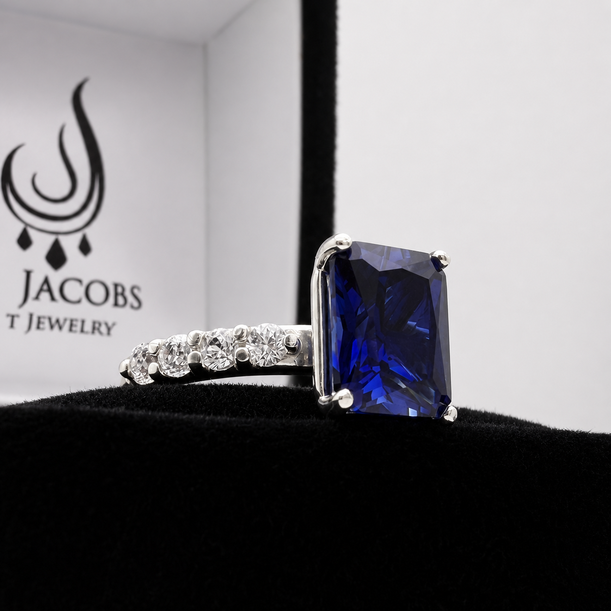 4.64 Carat Emerald Cut Blue Sapphire Ring with Diamond Accents