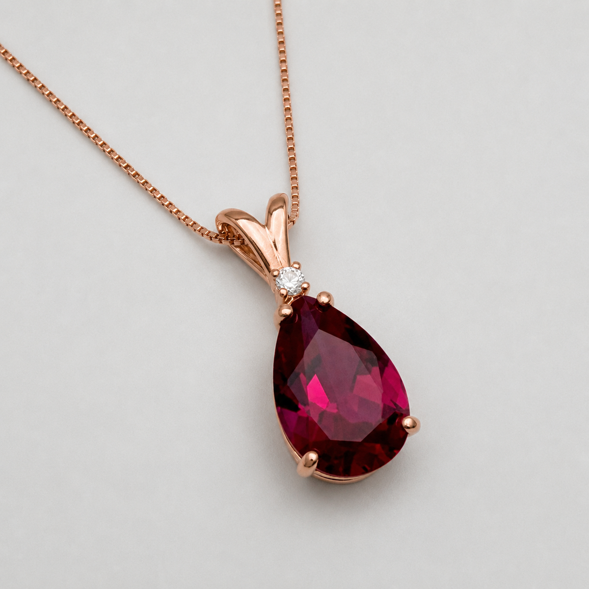7.5ct Pear Cut Ruby Pendant Necklace with Diamond Accent in 14k Gold