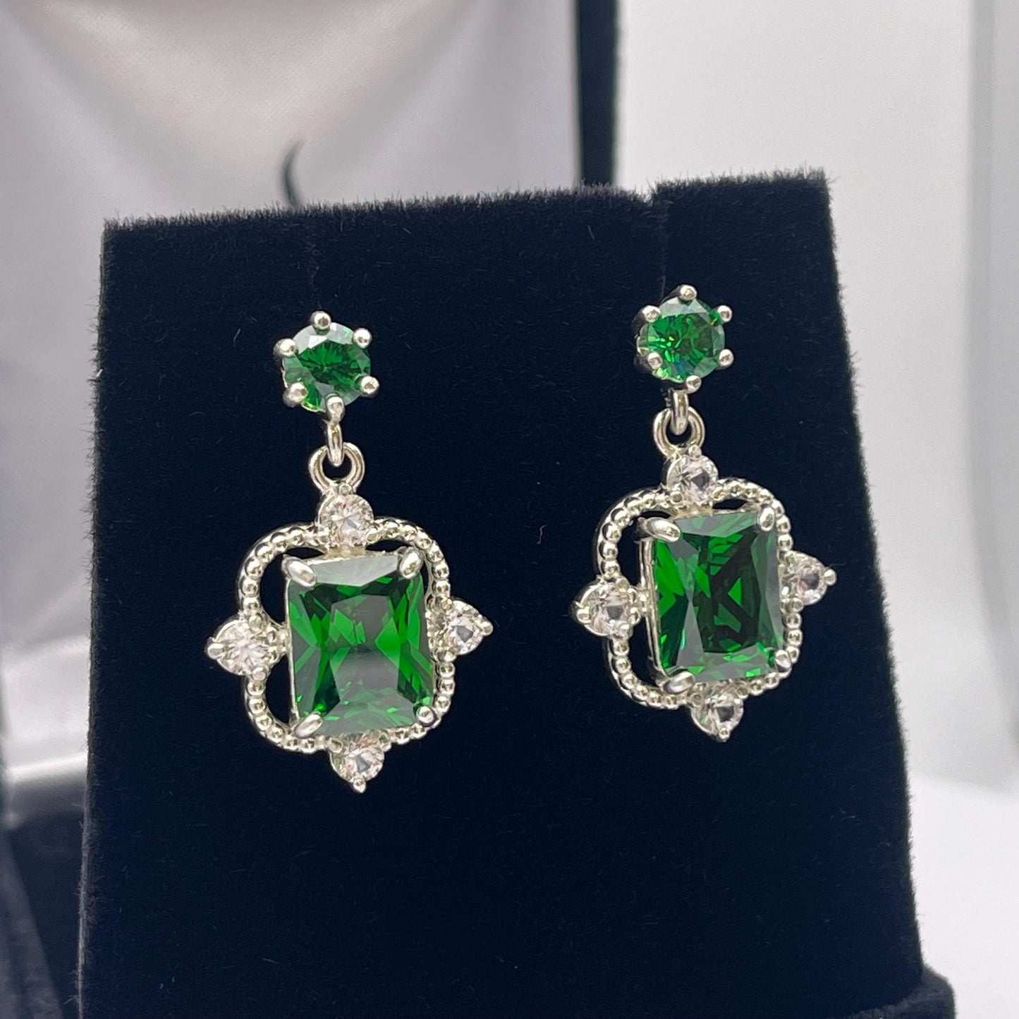 Gorgeous 10.4ctw Emerald Cut Emerald Earrings White Sapphire Accents