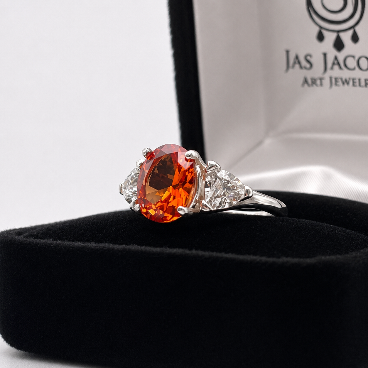 4.5CTW Oval Cut Padparadscha Sapphire & Trillion White Sapphire Three Stone Ring