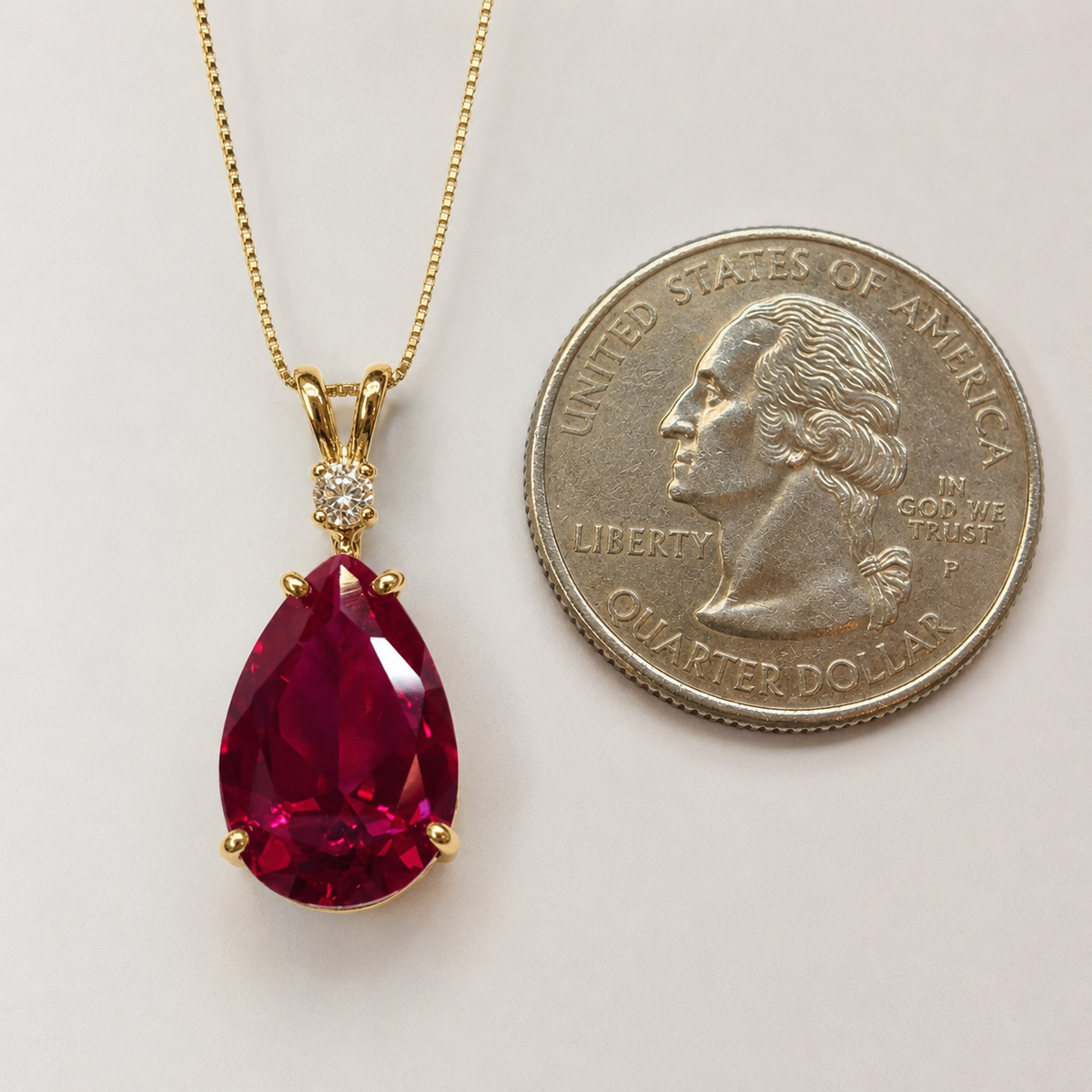 7.5ct Pear Cut Ruby Pendant Necklace with Diamond Accent in 14k Gold