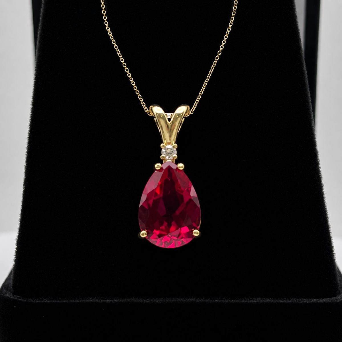 7.5ct Pear Cut Ruby Pendant Necklace with White Sapphire Accent