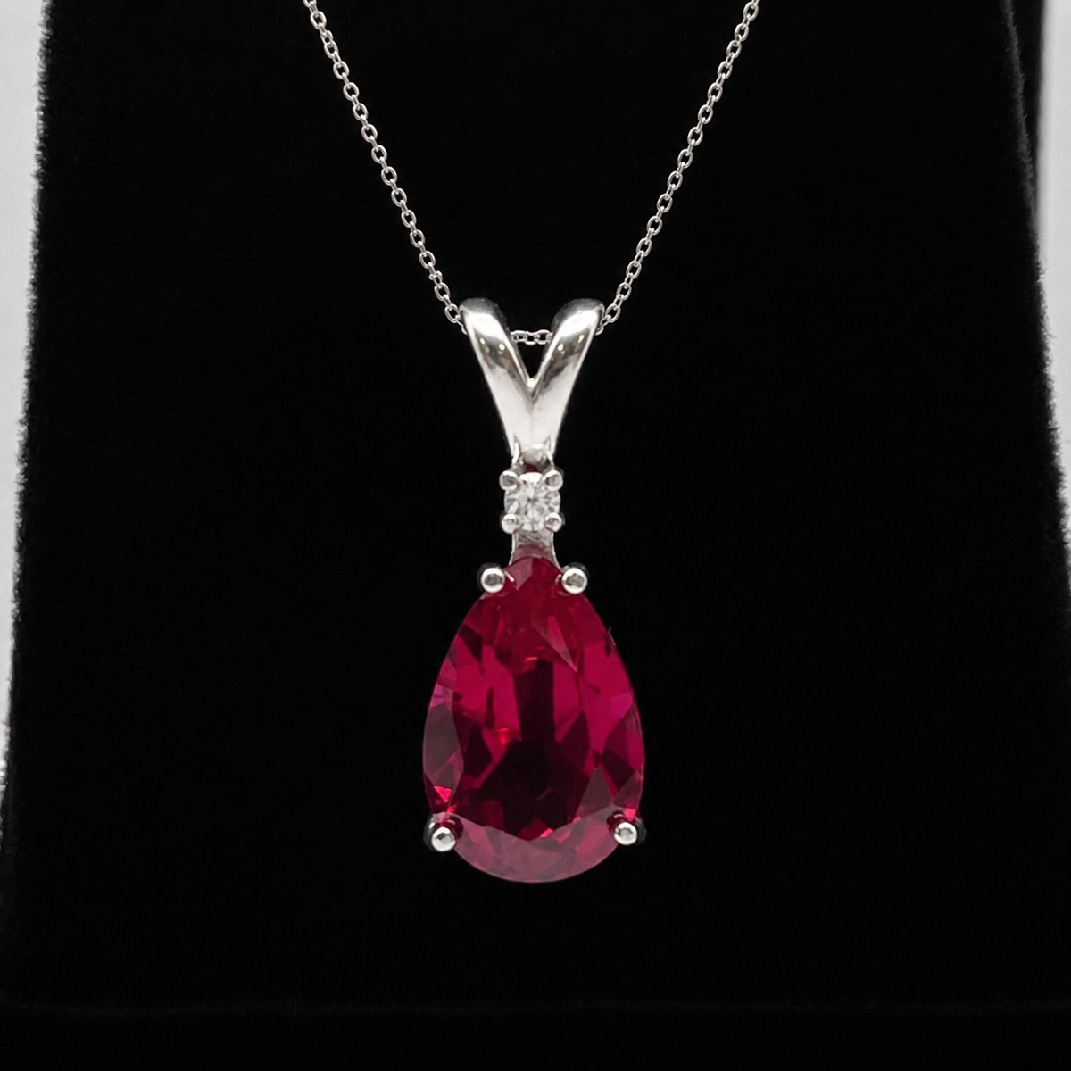 7.5ct Pear Cut Ruby Pendant Necklace with White Sapphire Accent