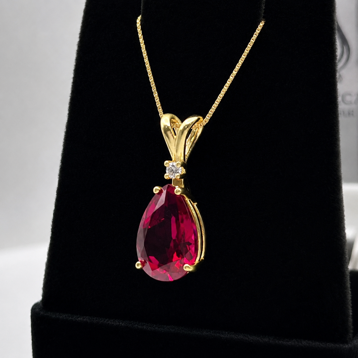 7.5ct Pear Cut Ruby Pendant Necklace with Diamond Accent in 14k Gold
