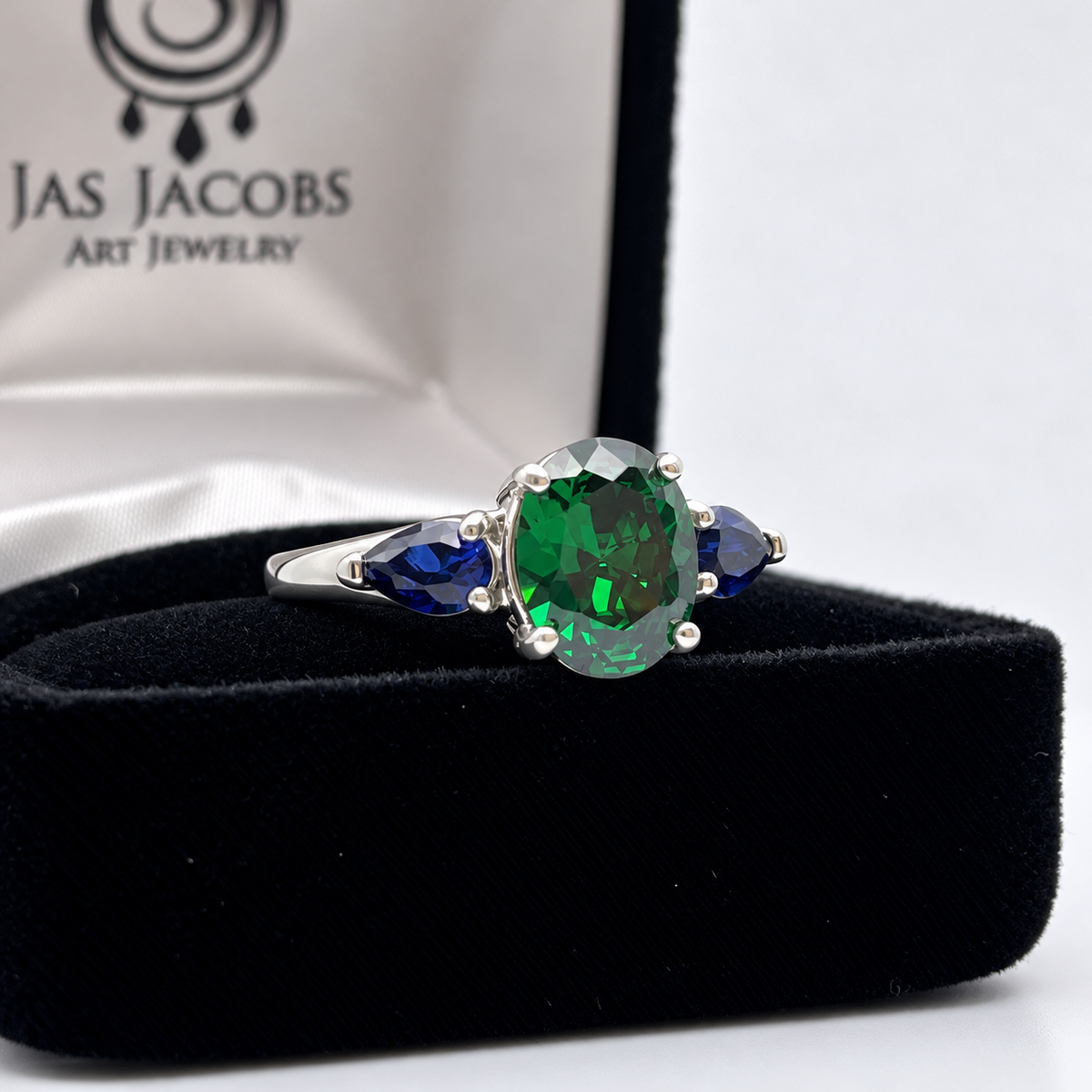 3.6ctw Oval Emerald & Pear Blue Sapphire Three Stone Ring