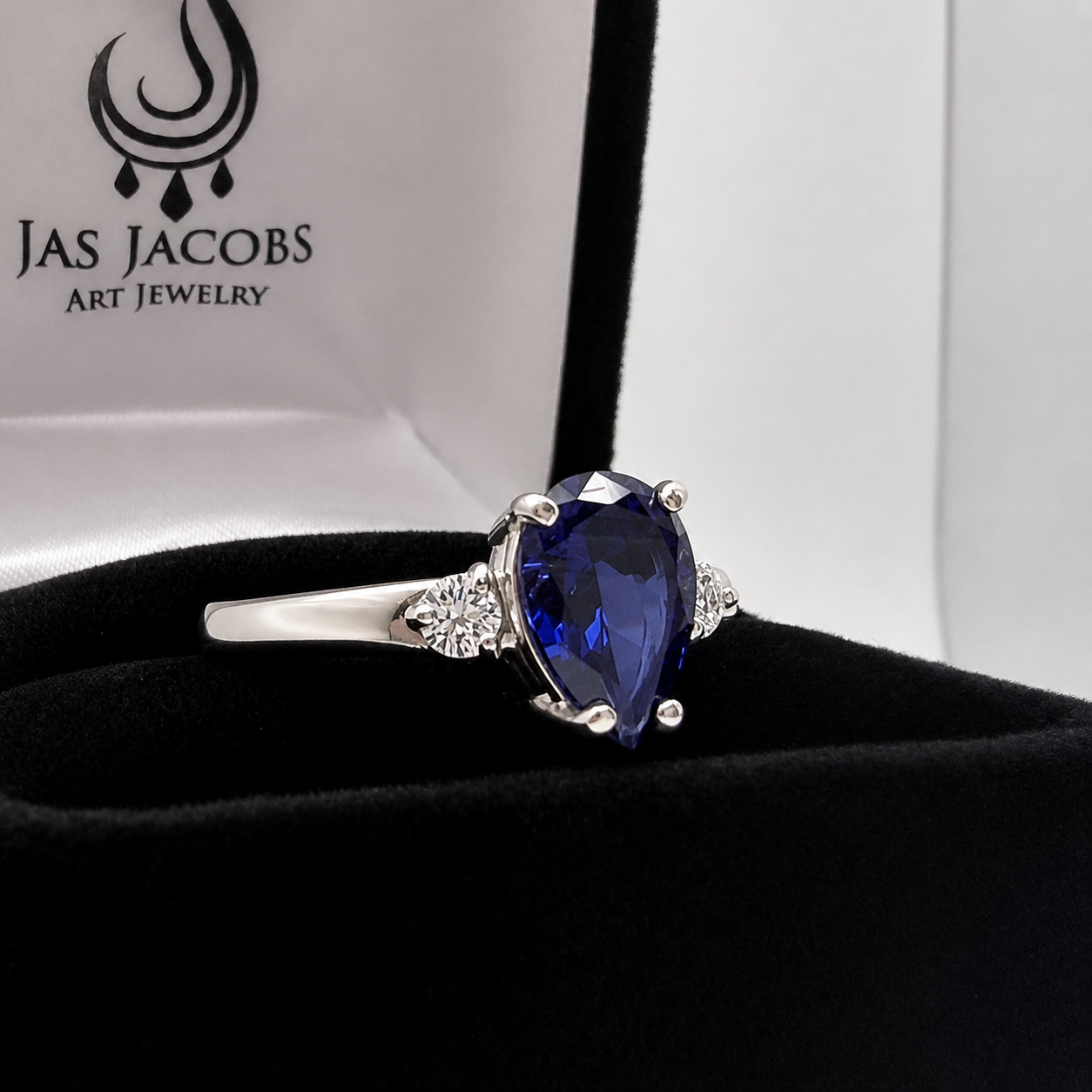 2.5CTW Pear Cut Sapphire Ring with White Sapphire Accents