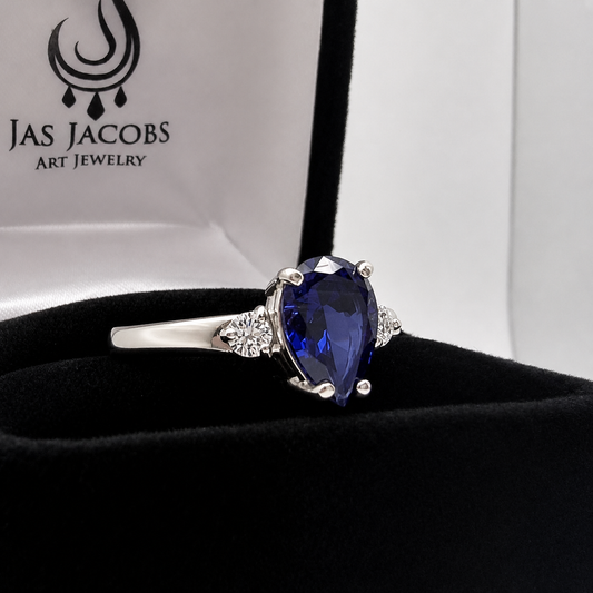 2.5CTW Pear Cut Sapphire Ring with White Sapphire Accents