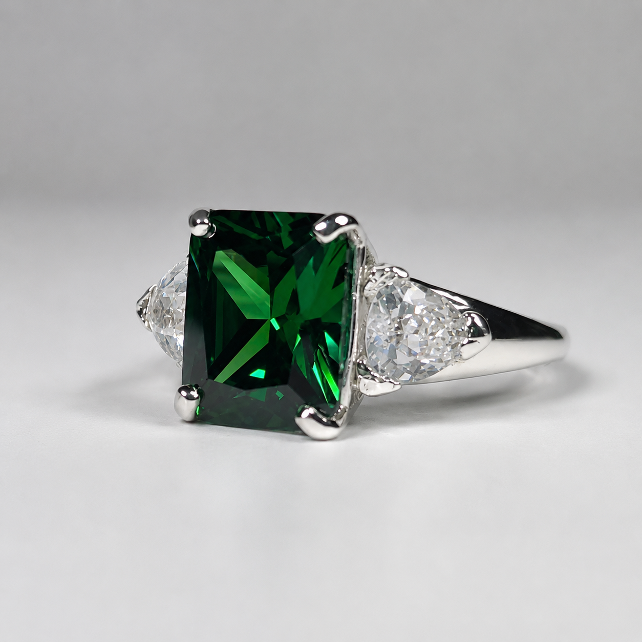 4.5CTW Emerald Cut Emerald Ring | Trillion White Sapphire Three Stone Ring