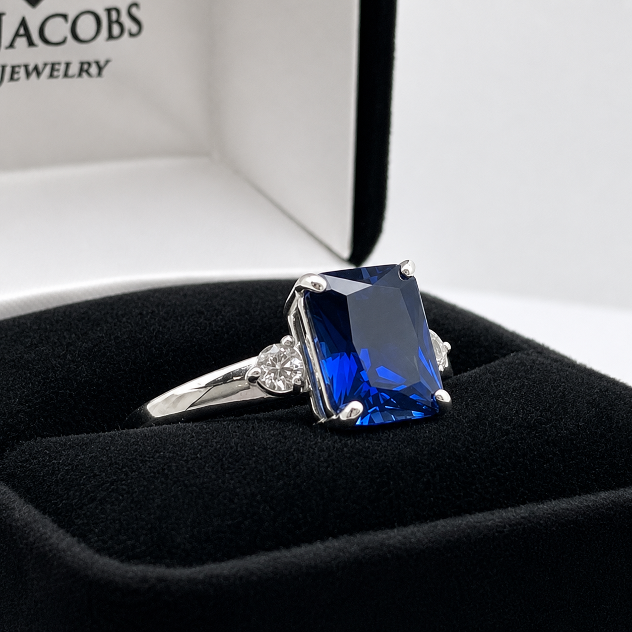 4 Carat Emerald Cut Blue Sapphire Ring with Diamond Accents