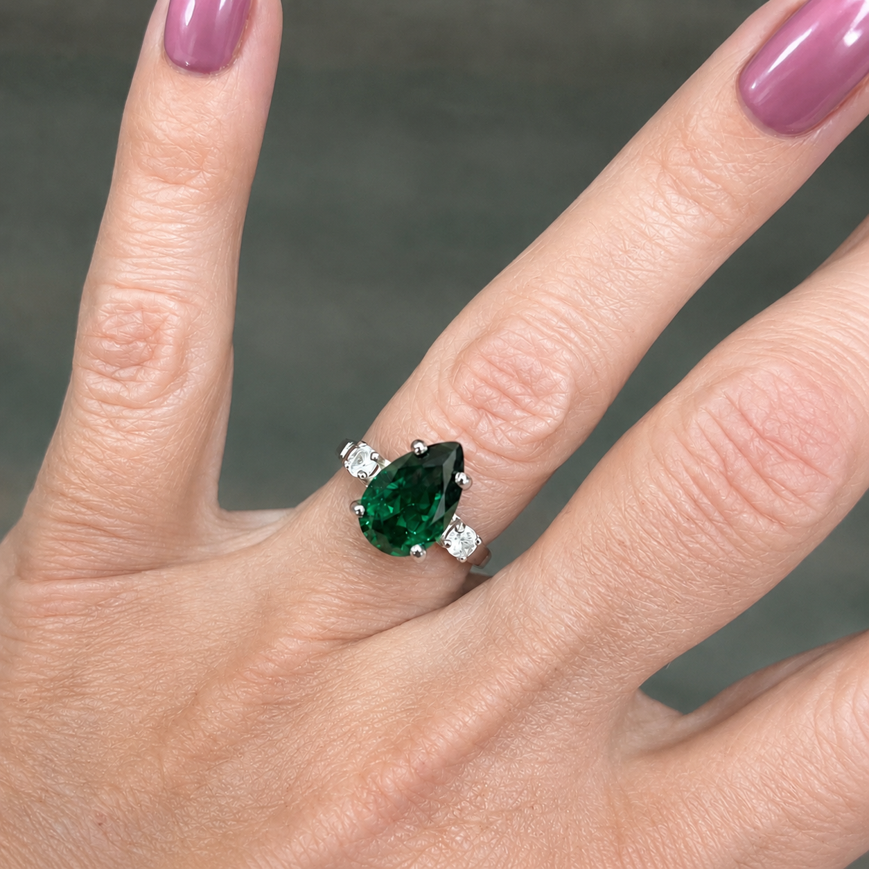 3.7CTW Pear Cut Emerald Ring with White Sapphire Accents
