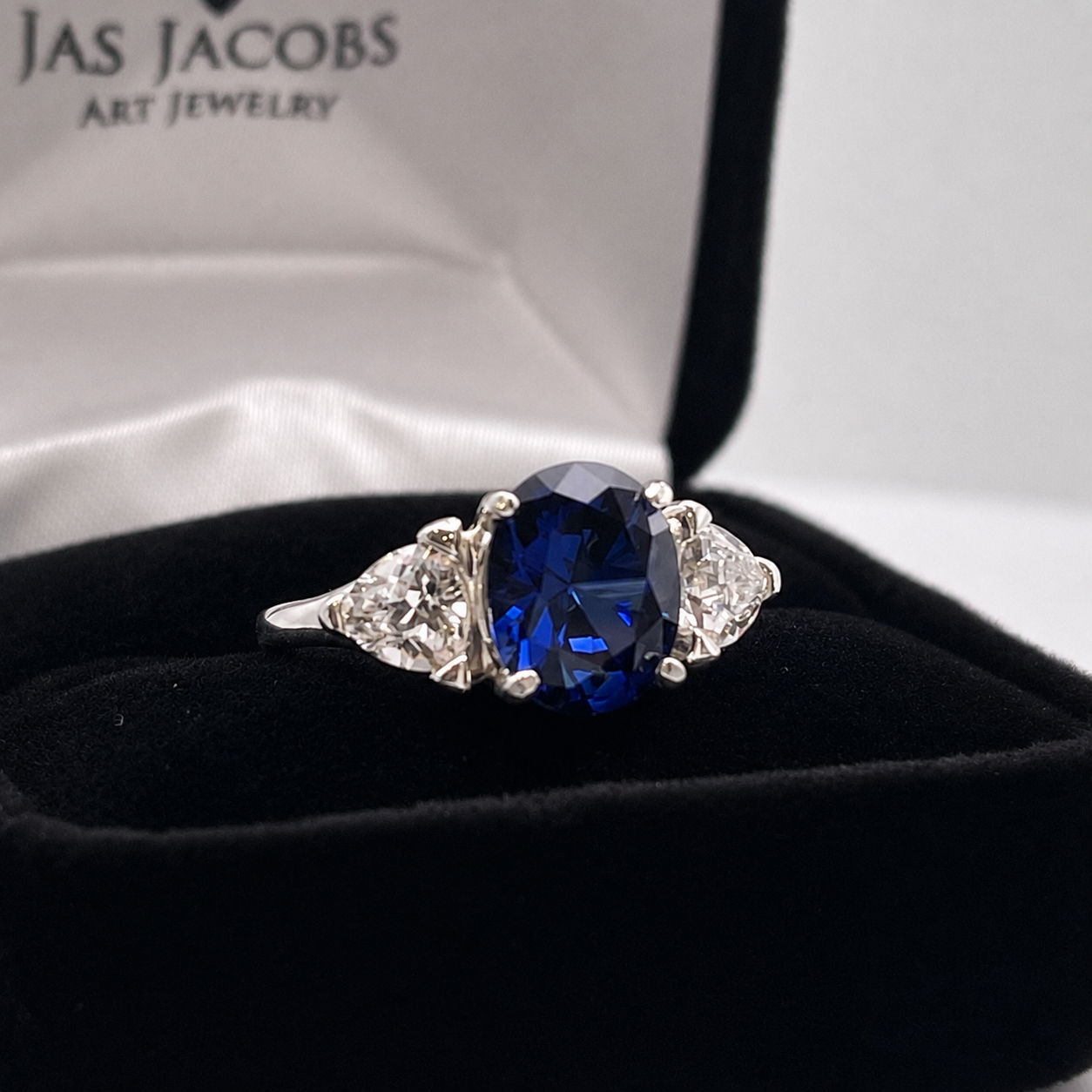4.5ctw Oval Cut Blue Sapphire Three Stone Ring | Trillion Cut White Sapphires