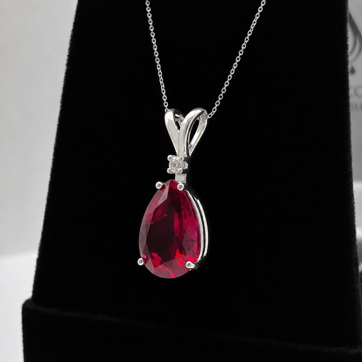7.5ct Pear Cut Ruby Pendant Necklace with White Sapphire Accent