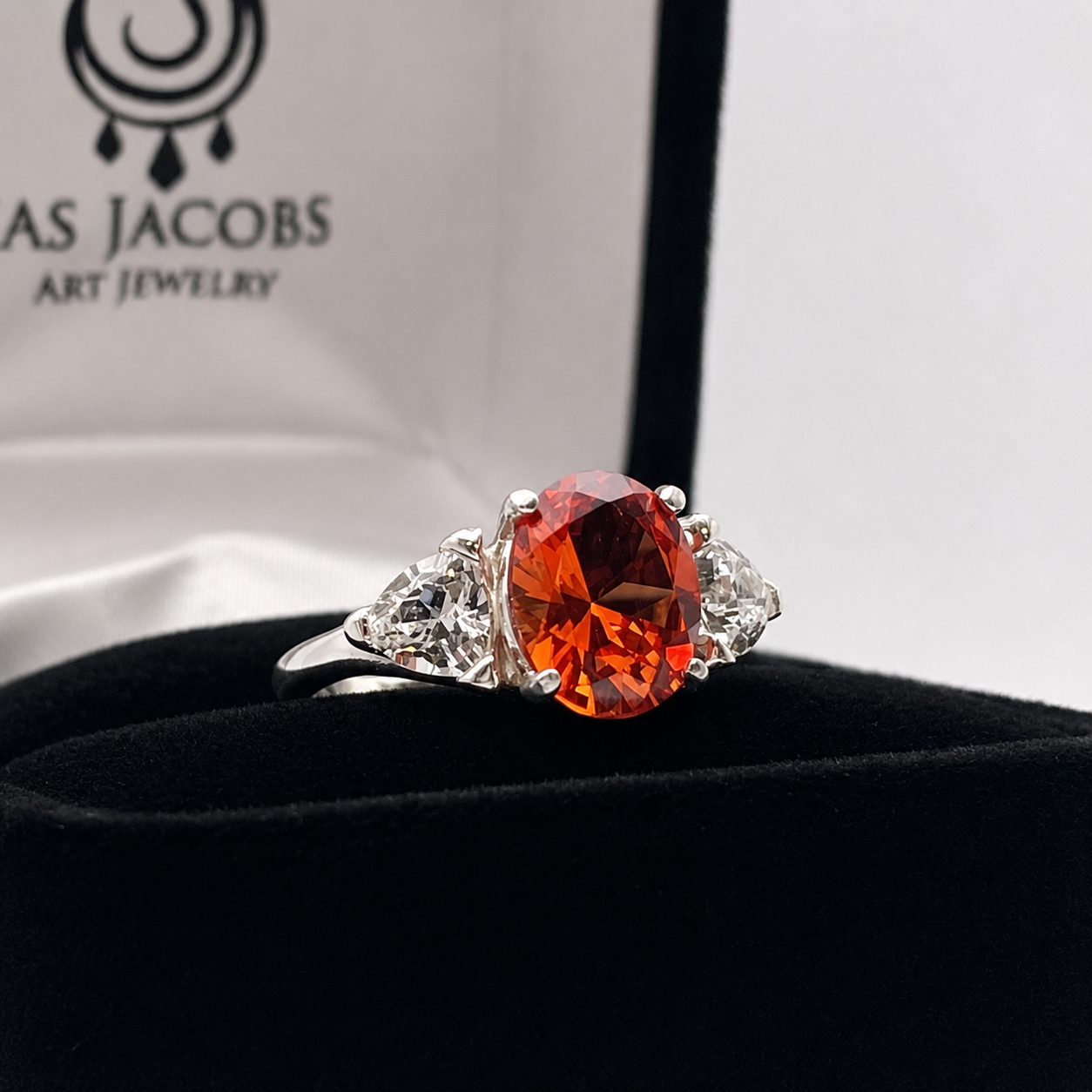 4.5CTW Oval Cut Padparadscha Sapphire & Trillion White Sapphire Three Stone Ring