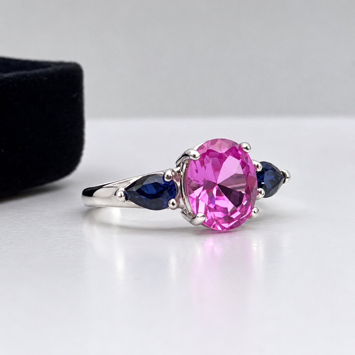 4.5ctw Oval Cut Pink & Blue Sapphire Three-Stone Ring