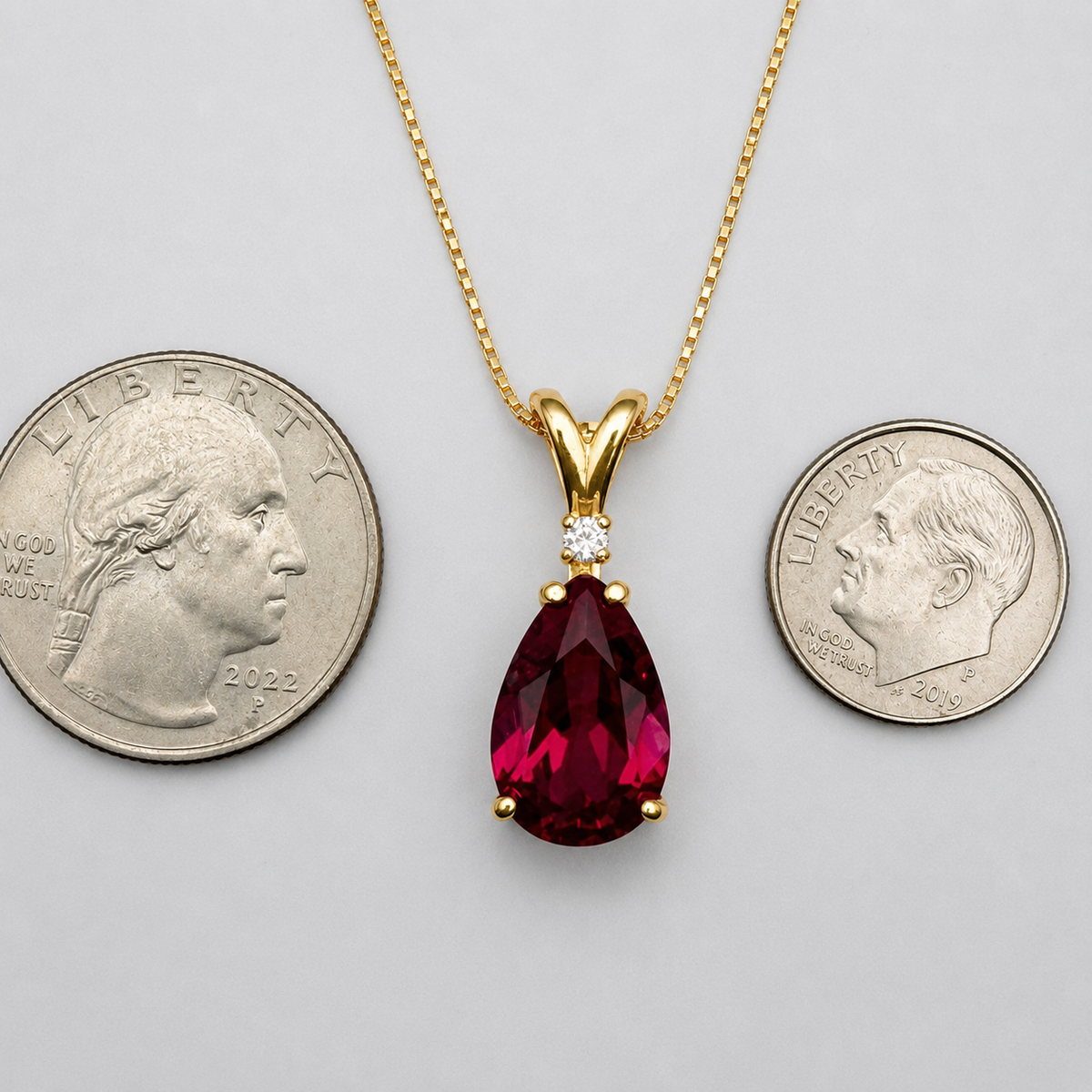 7.5ct Pear Cut Ruby Pendant Necklace with Diamond Accent in 14k Gold