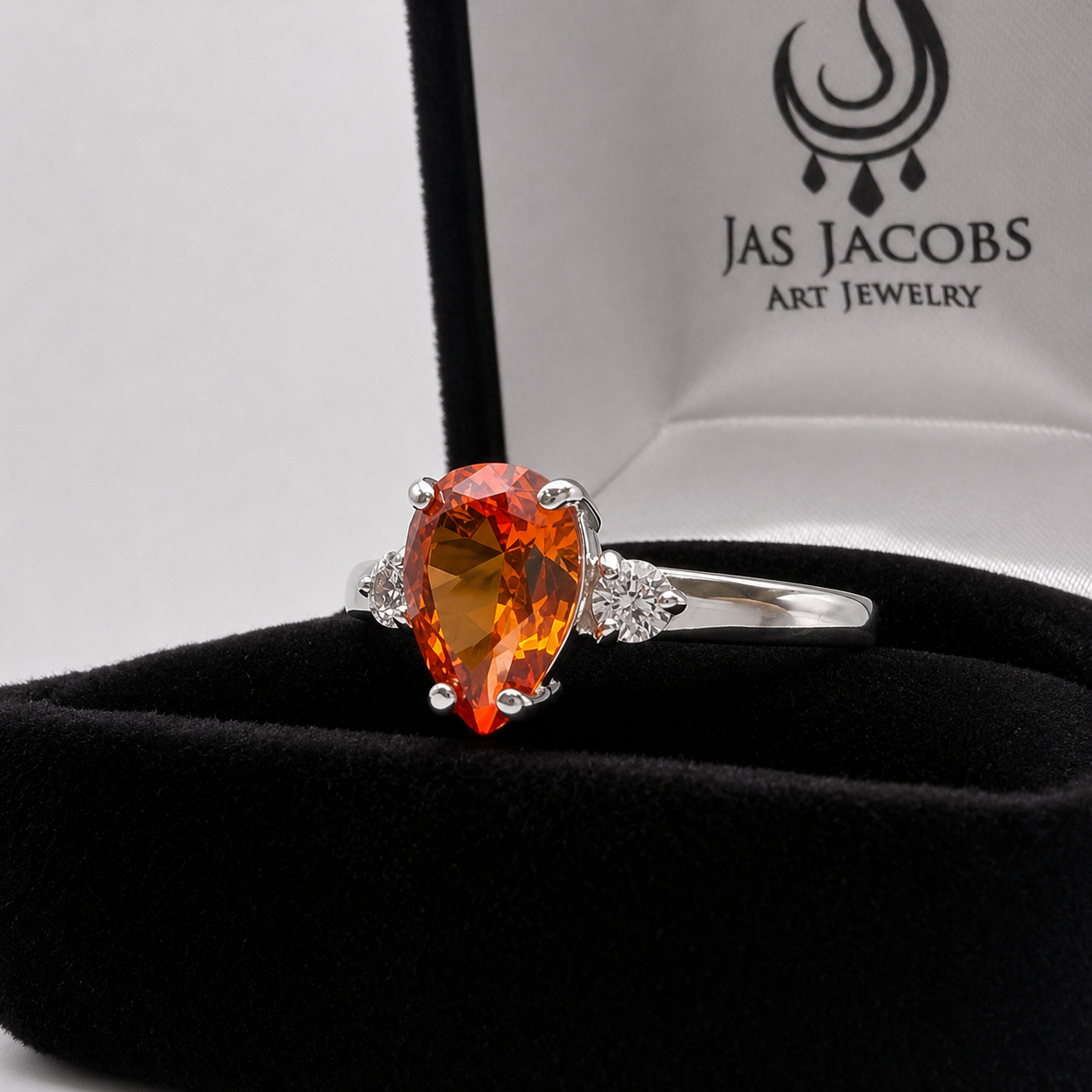 2.5CTW Pear Cut Padparadscha Sapphire Ring with White Sapphire Accents