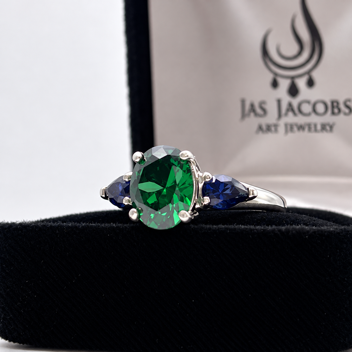 3.6ctw Oval Emerald & Pear Blue Sapphire Three Stone Ring