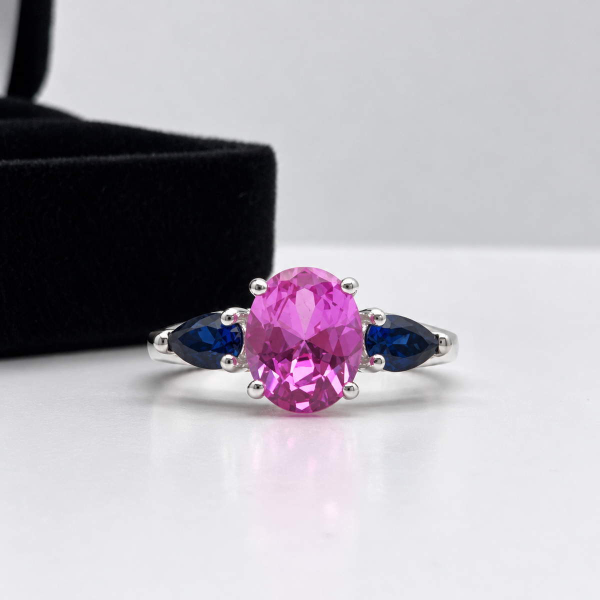 4.5ctw Oval Cut Pink & Blue Sapphire Three-Stone Ring