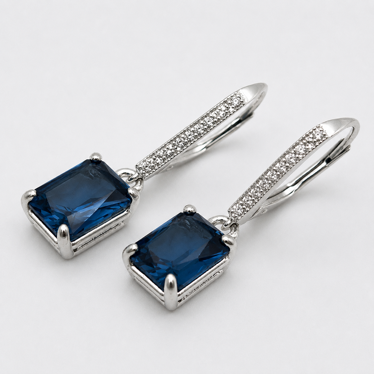 5.2ctw Emerald Cut London Blue Spinel & White Topaz Leverback Earrings