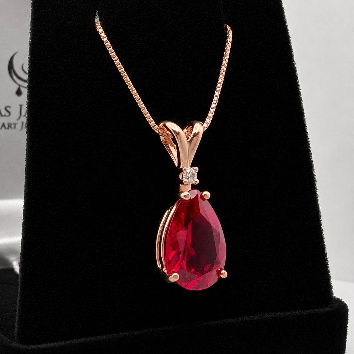 7.5ct Pear Cut Ruby Pendant Necklace with Diamond Accent in 14k Gold