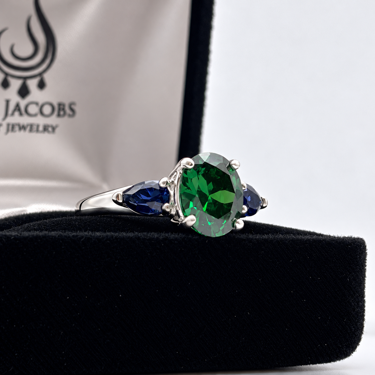 3.6ctw Oval Emerald & Pear Blue Sapphire Three Stone Ring