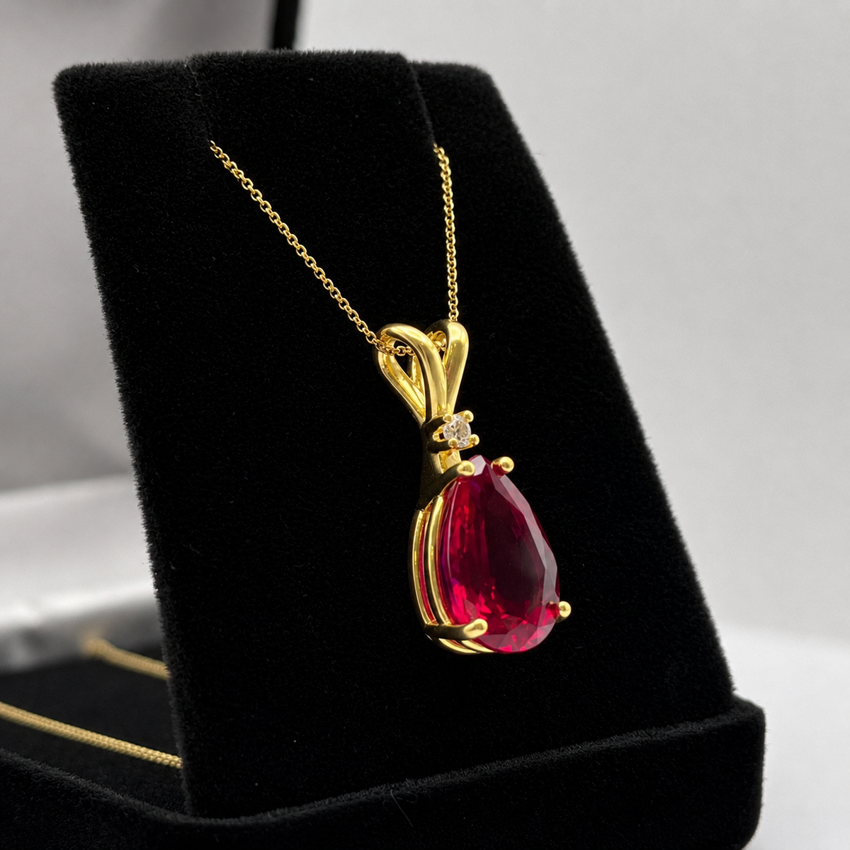 7.5ct Pear Cut Ruby Pendant Necklace with White Sapphire Accent