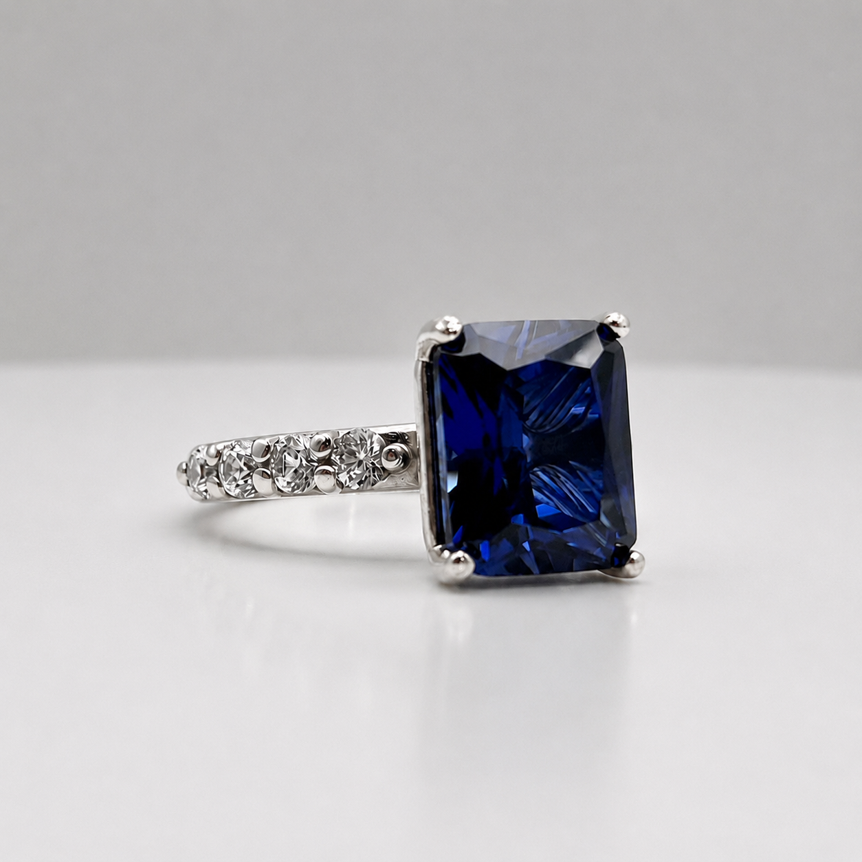 4.64 Carat Emerald Cut Blue Sapphire Ring with Diamond Accents