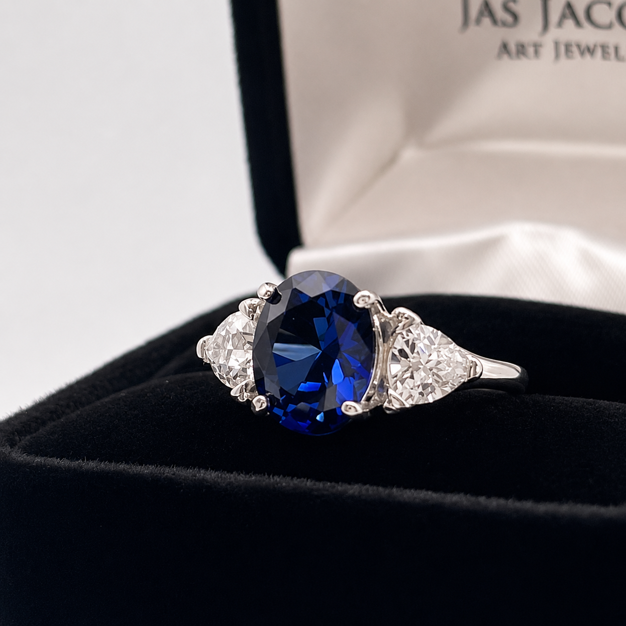 4.5ctw Oval Cut Blue Sapphire Three Stone Ring | Trillion Cut White Sapphires