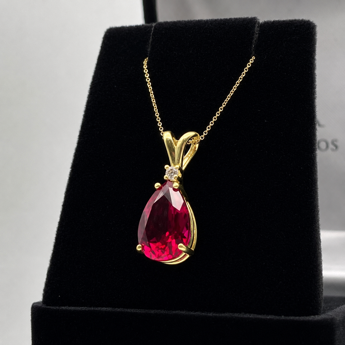 7.5ct Pear Cut Ruby Pendant Necklace with White Sapphire Accent