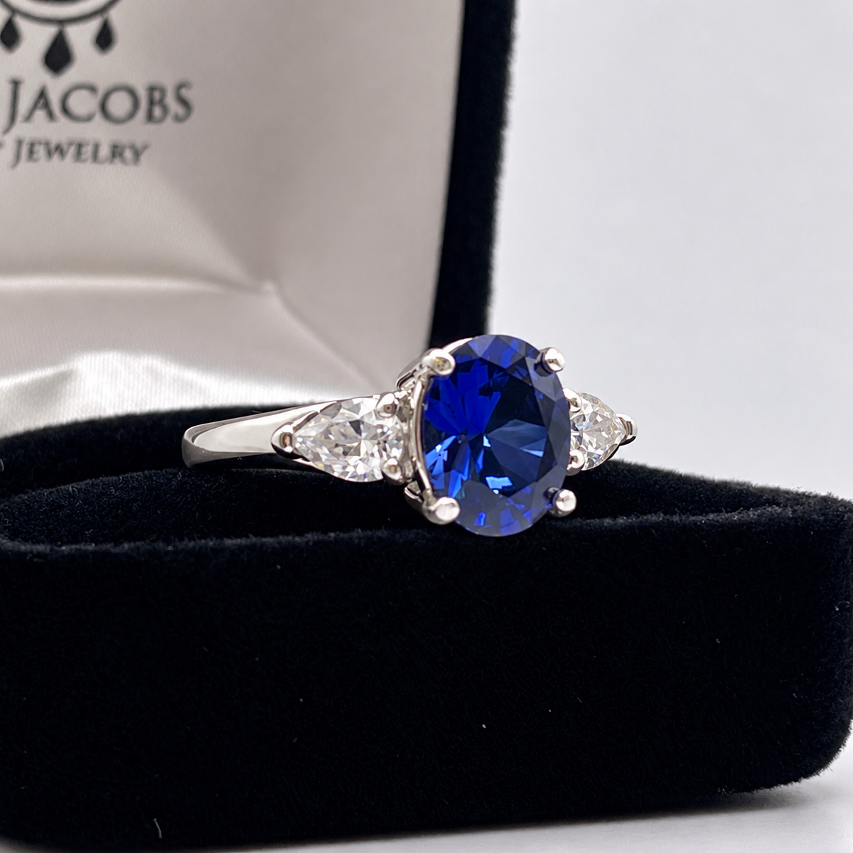 4.5ctw Oval Blue Sapphire & White Sapphire Three Stone Ring