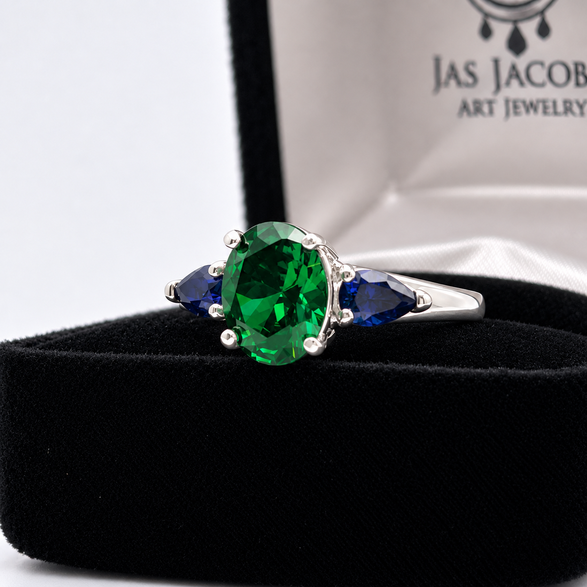 3.6ctw Oval Emerald & Pear Blue Sapphire Three Stone Ring