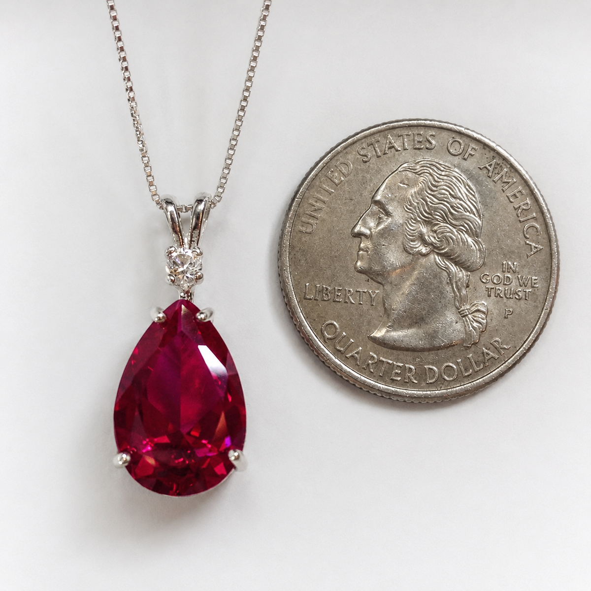7.5ct Pear Cut Ruby Pendant Necklace with White Sapphire Accent in Sterling Silver
