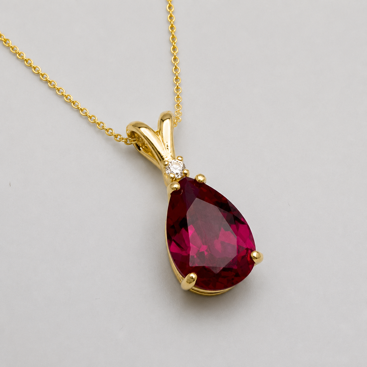 7.5ct Pear Cut Ruby Pendant Necklace with White Sapphire Accent