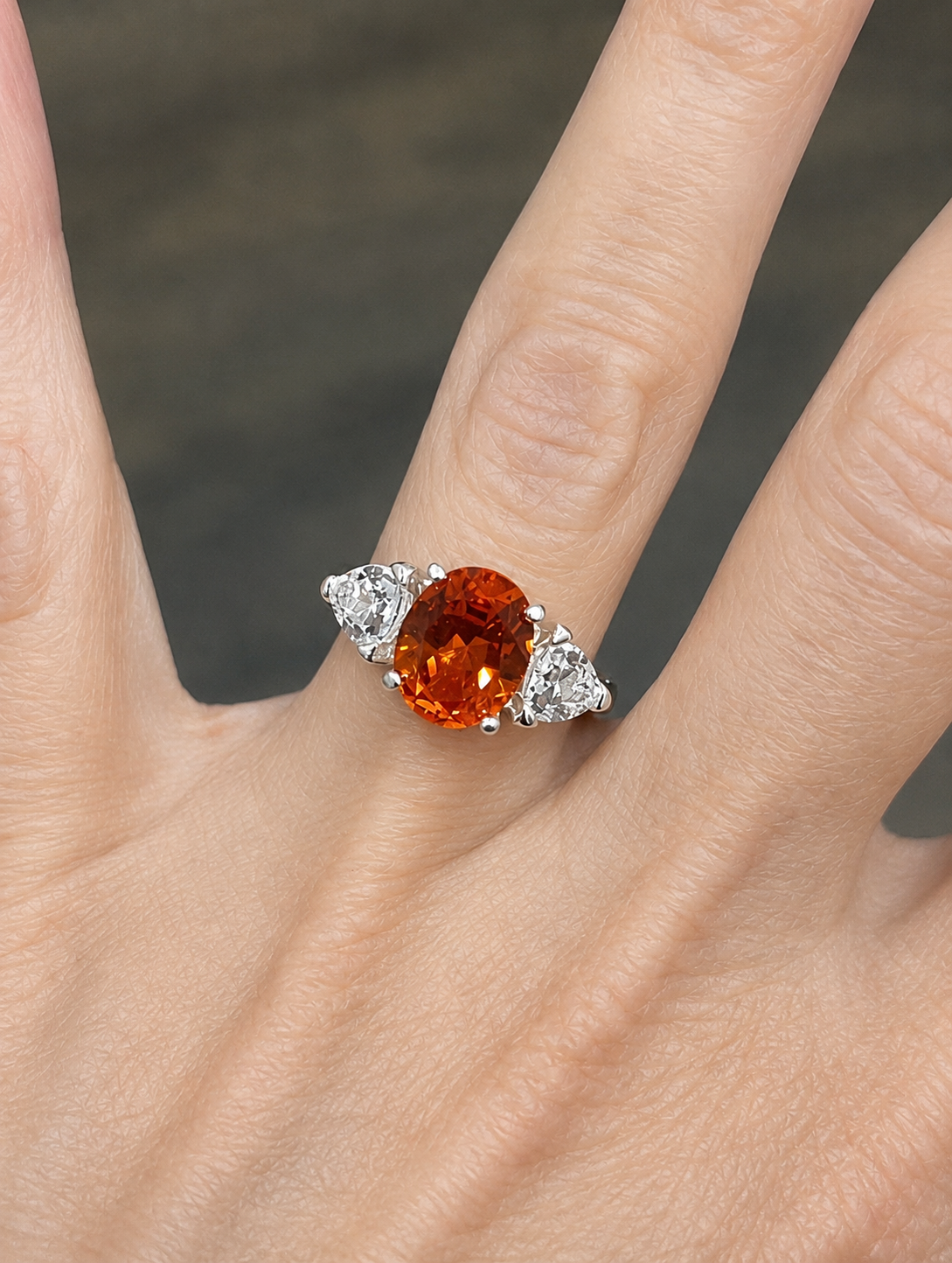 4.5CTW Oval Cut Padparadscha Sapphire & Trillion White Sapphire Three Stone Ring