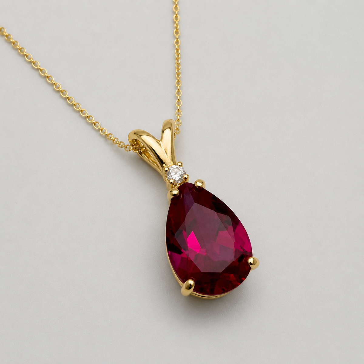 7.5ct Pear Cut Ruby Pendant Necklace with White Sapphire Accent