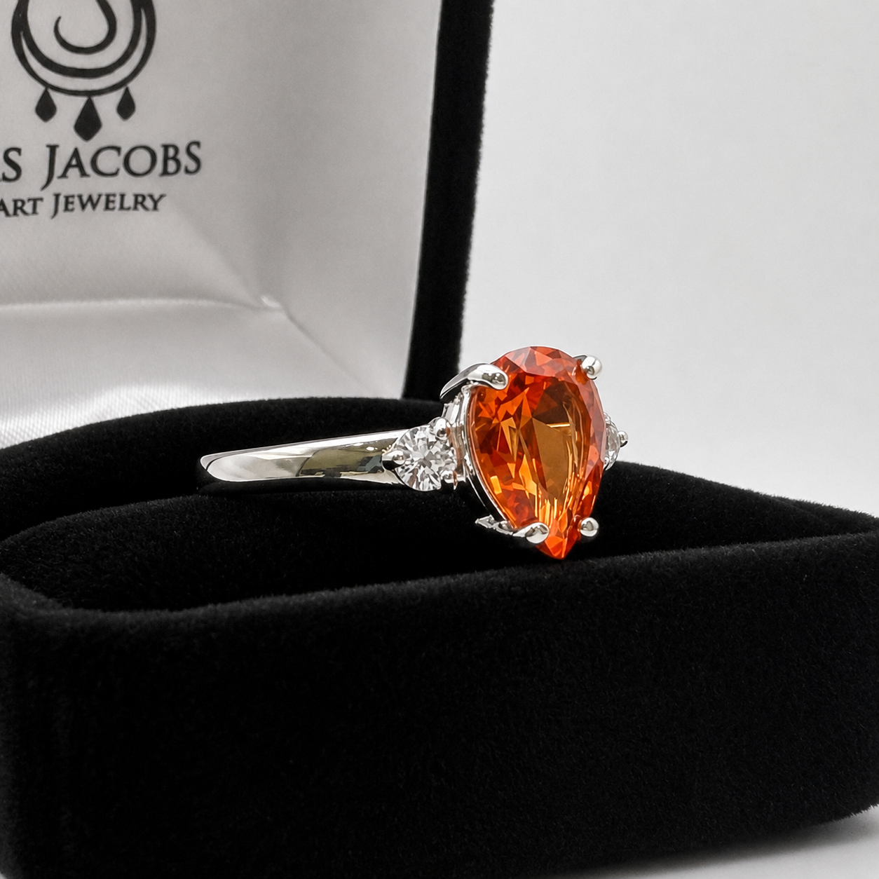 2.5CTW Pear Cut Padparadscha Sapphire Ring with White Sapphire Accents