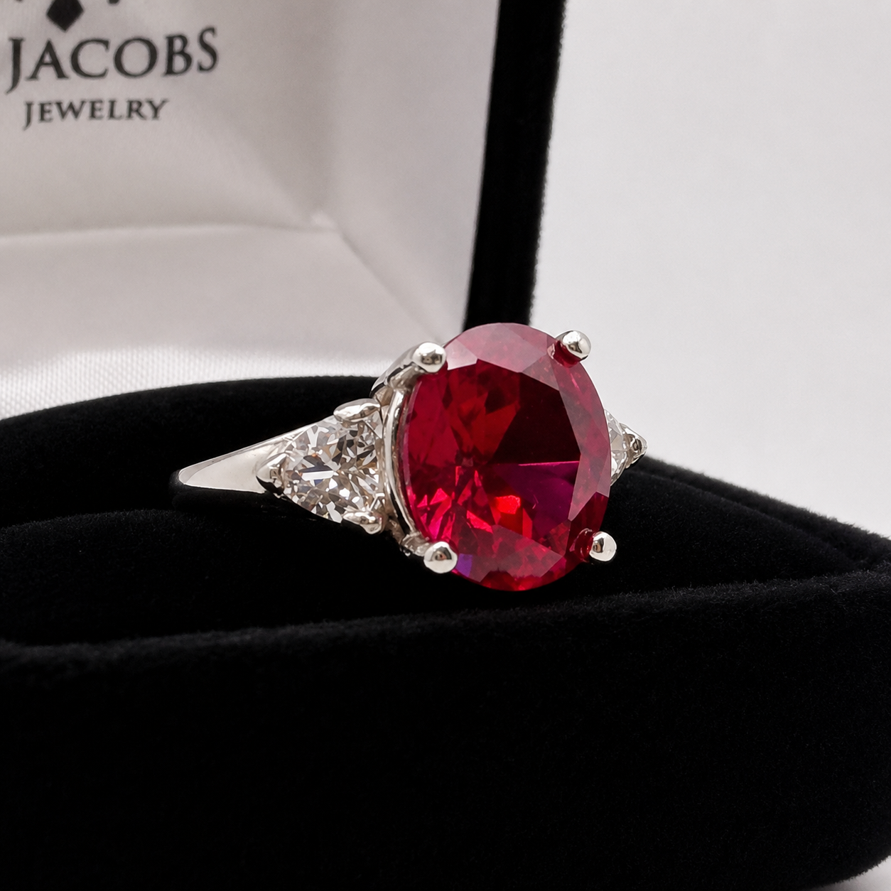 6.5ctw Oval Cut Ruby & Trillion Cut White Sapphire Three Stone Ring