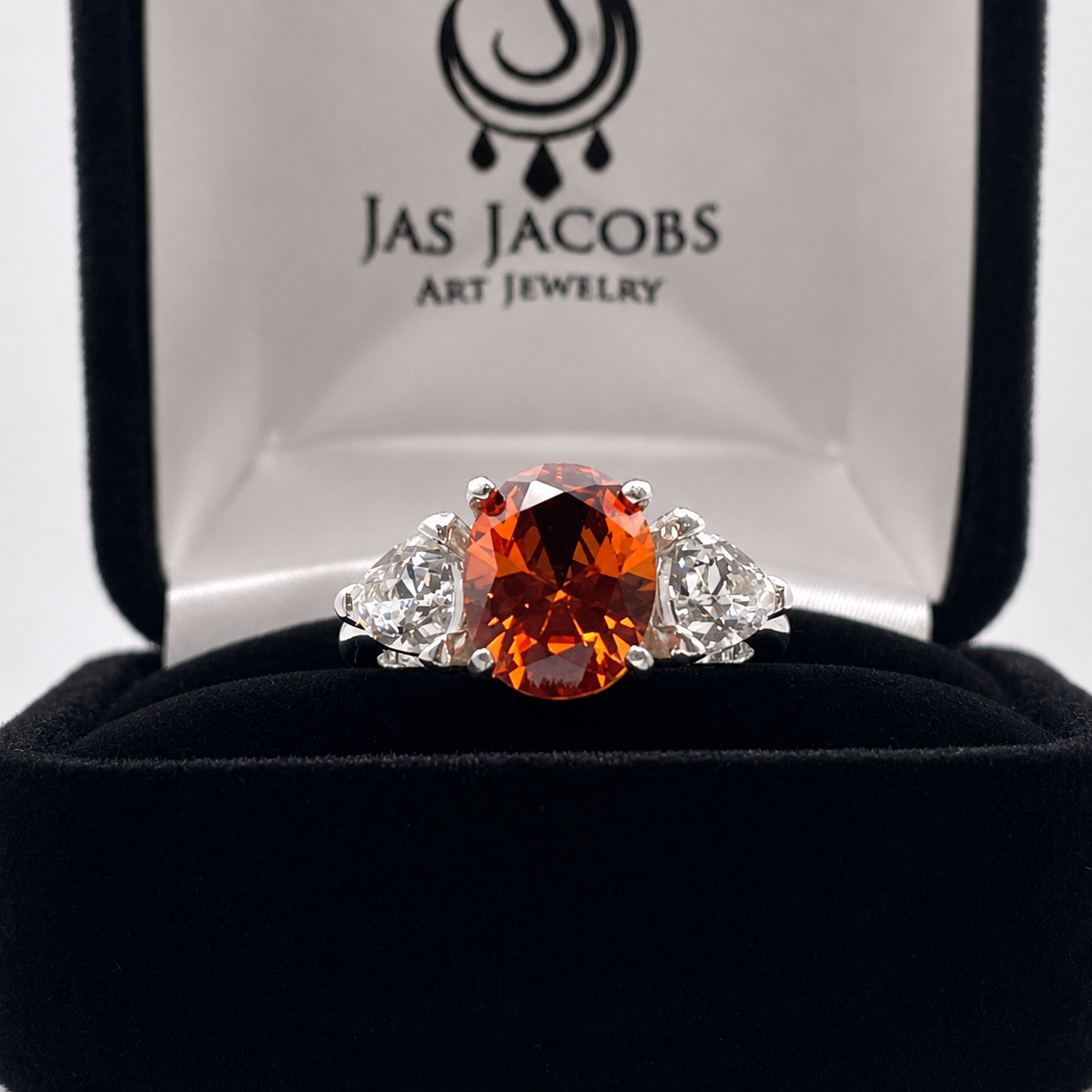 4.5CTW Oval Cut Padparadscha Sapphire & Trillion White Sapphire Three Stone Ring
