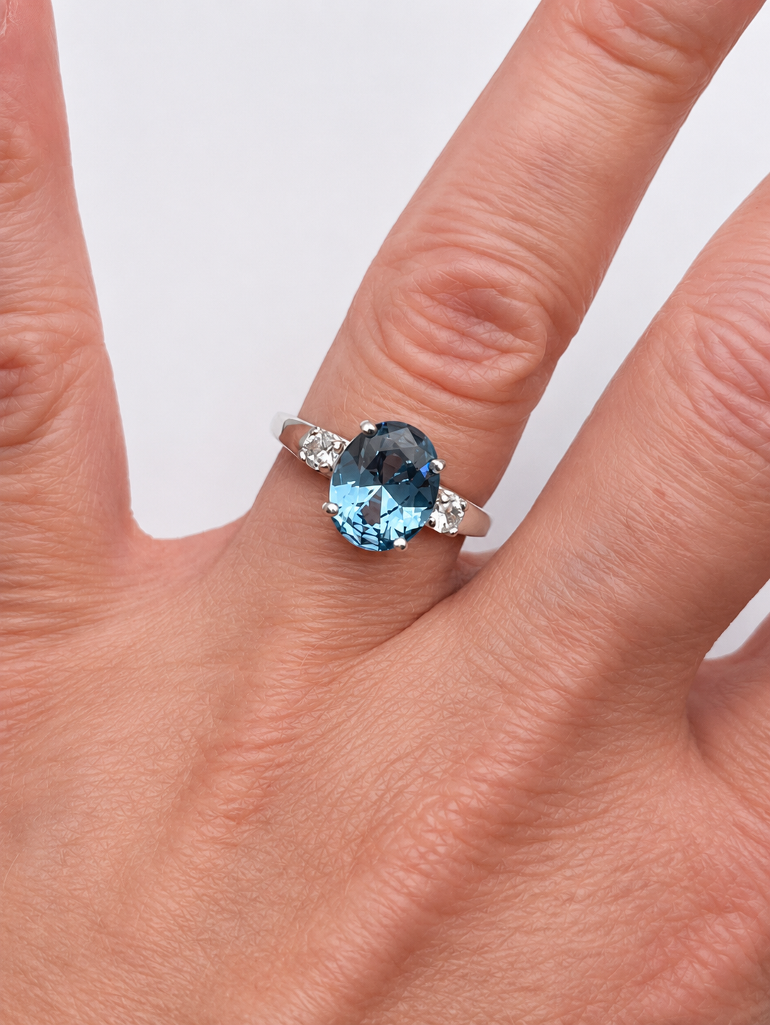 2.6CTW Oval Cut Blue Topaz Ring | White Sapphire Accents