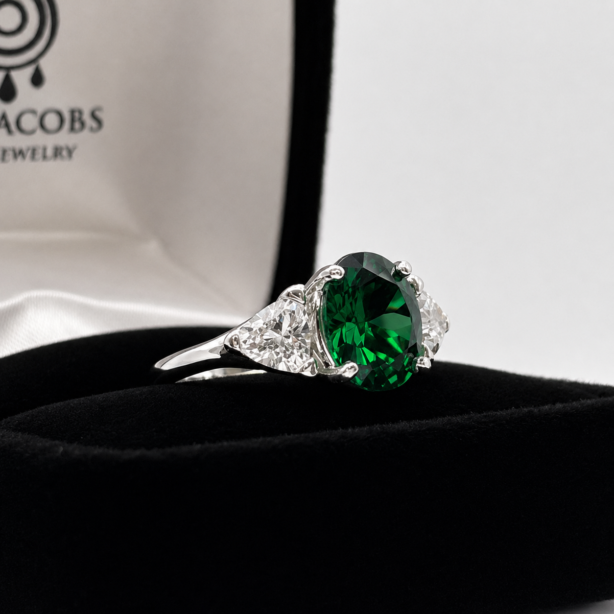 4ctw Oval Cut Lab Grown Emerald & Trillion White Sapphire Three Stone Ring