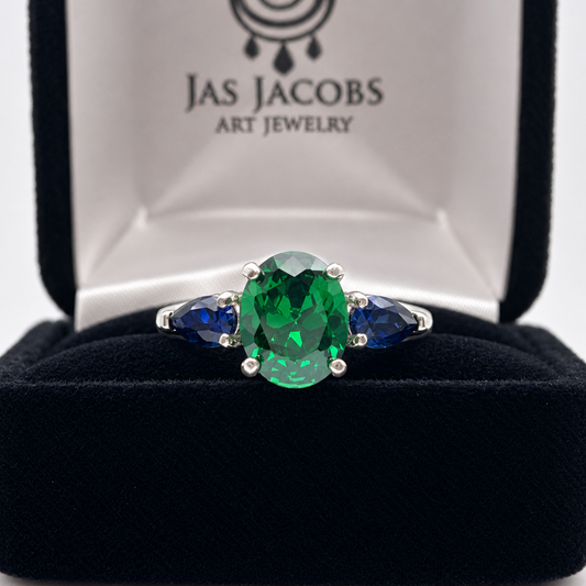 3.6ctw Oval Emerald & Pear Blue Sapphire Three Stone Ring