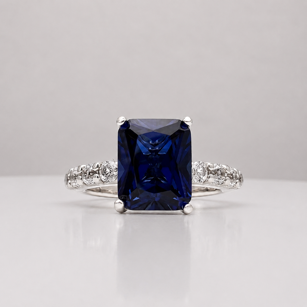 4.64 Carat Emerald Cut Blue Sapphire Ring with Diamond Accents