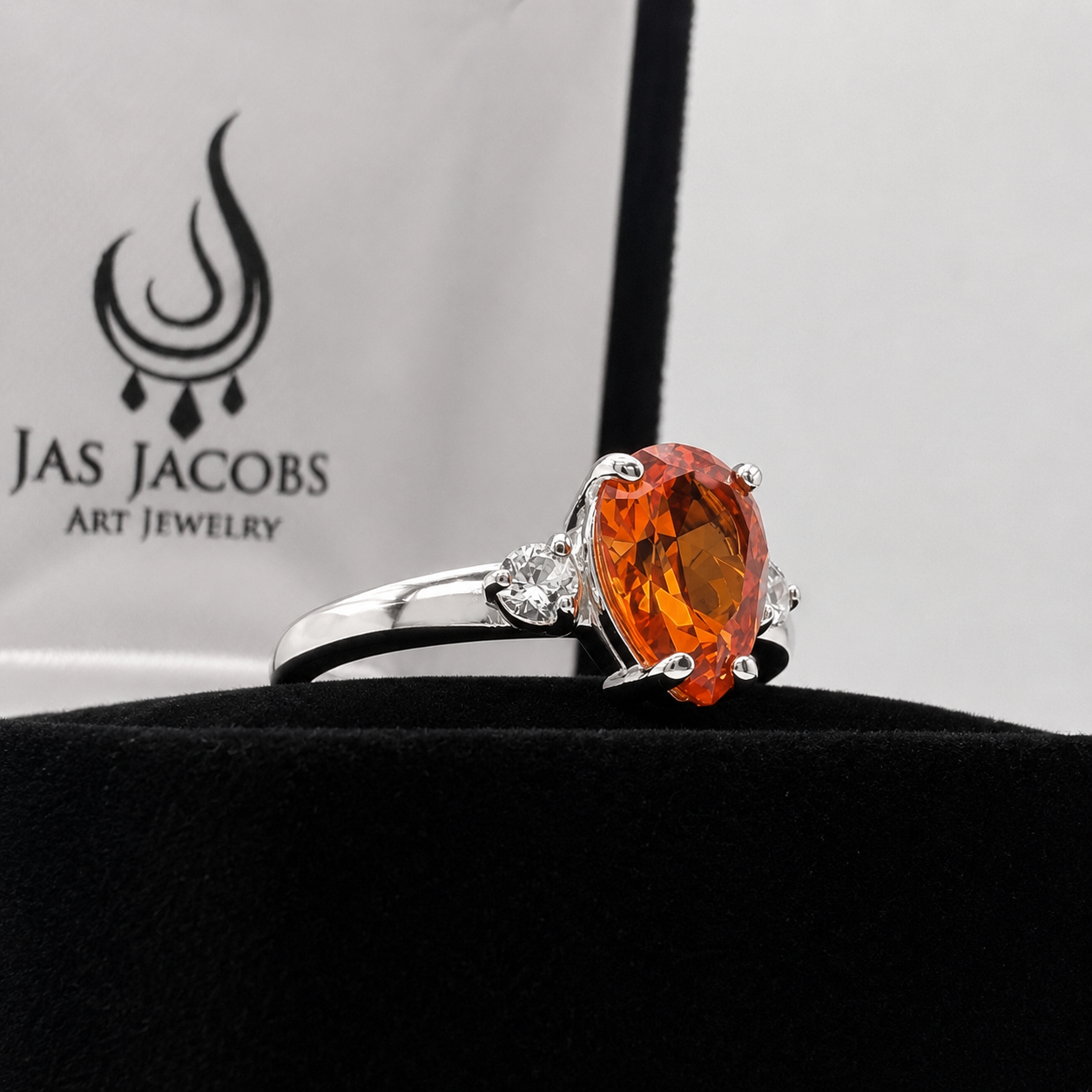 2.5CTW Pear Cut Padparadscha Sapphire Ring with White Sapphire Accents