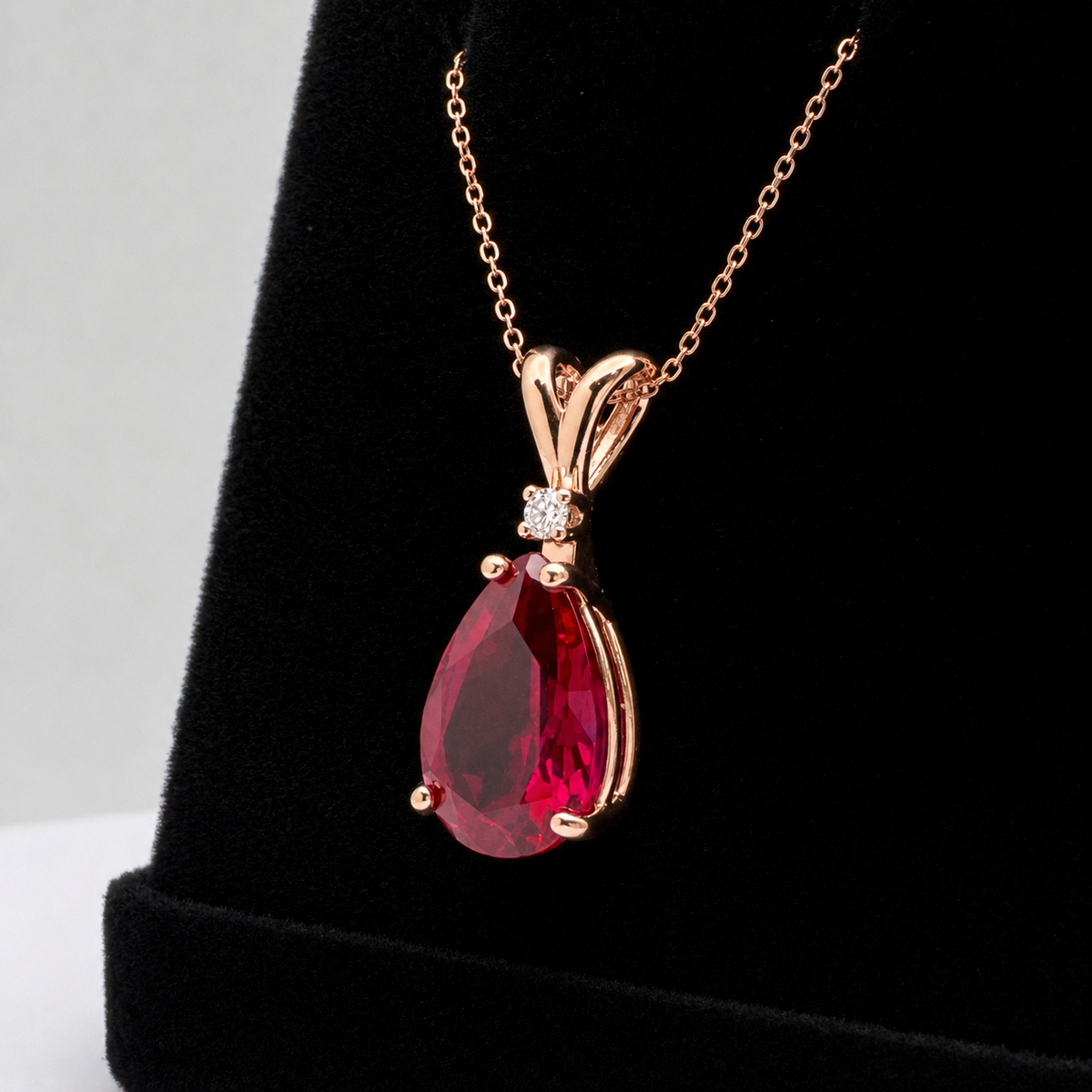 7.5ct Pear Cut Ruby Pendant Necklace with White Sapphire Accent