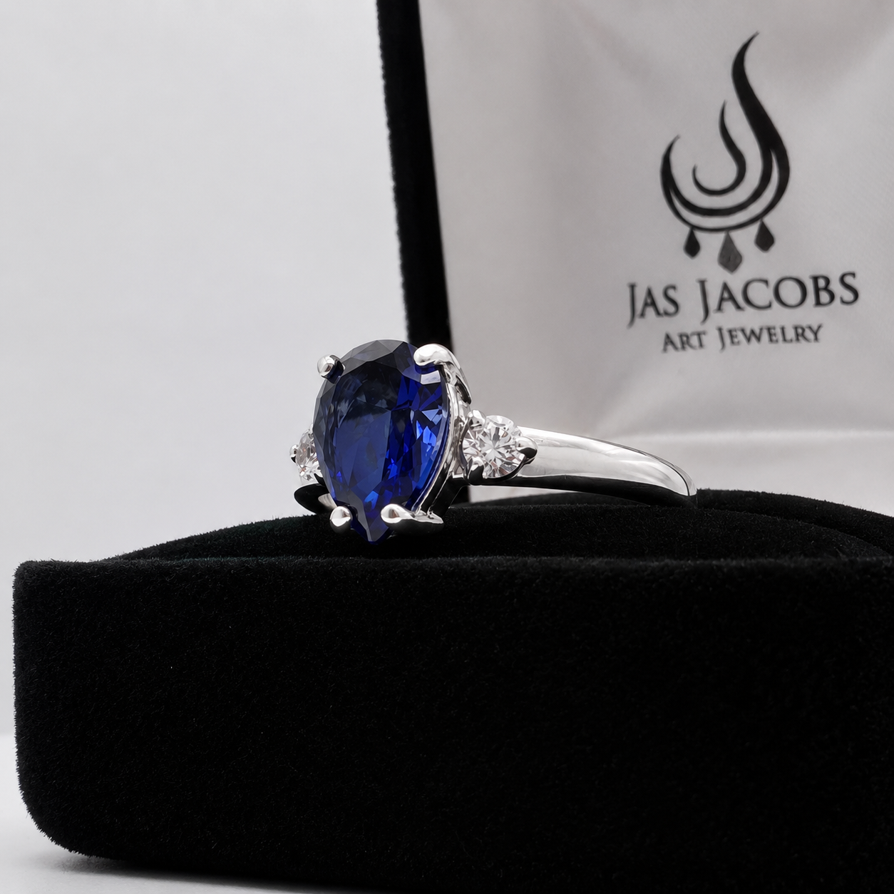 2.5CTW Pear Cut Sapphire Ring with White Sapphire Accents