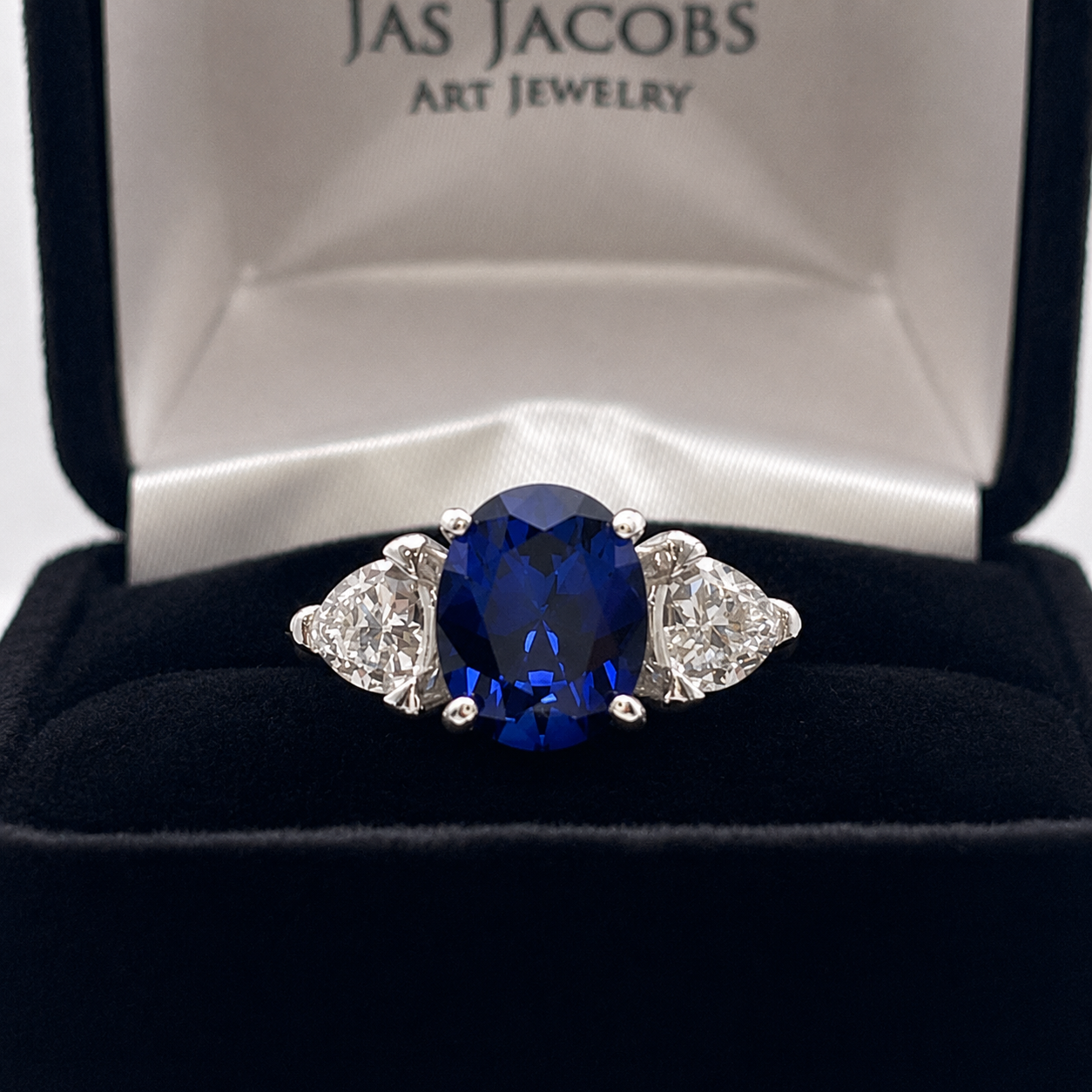 4.5ctw Oval Cut Blue Sapphire Three Stone Ring | Trillion Cut White Sapphires
