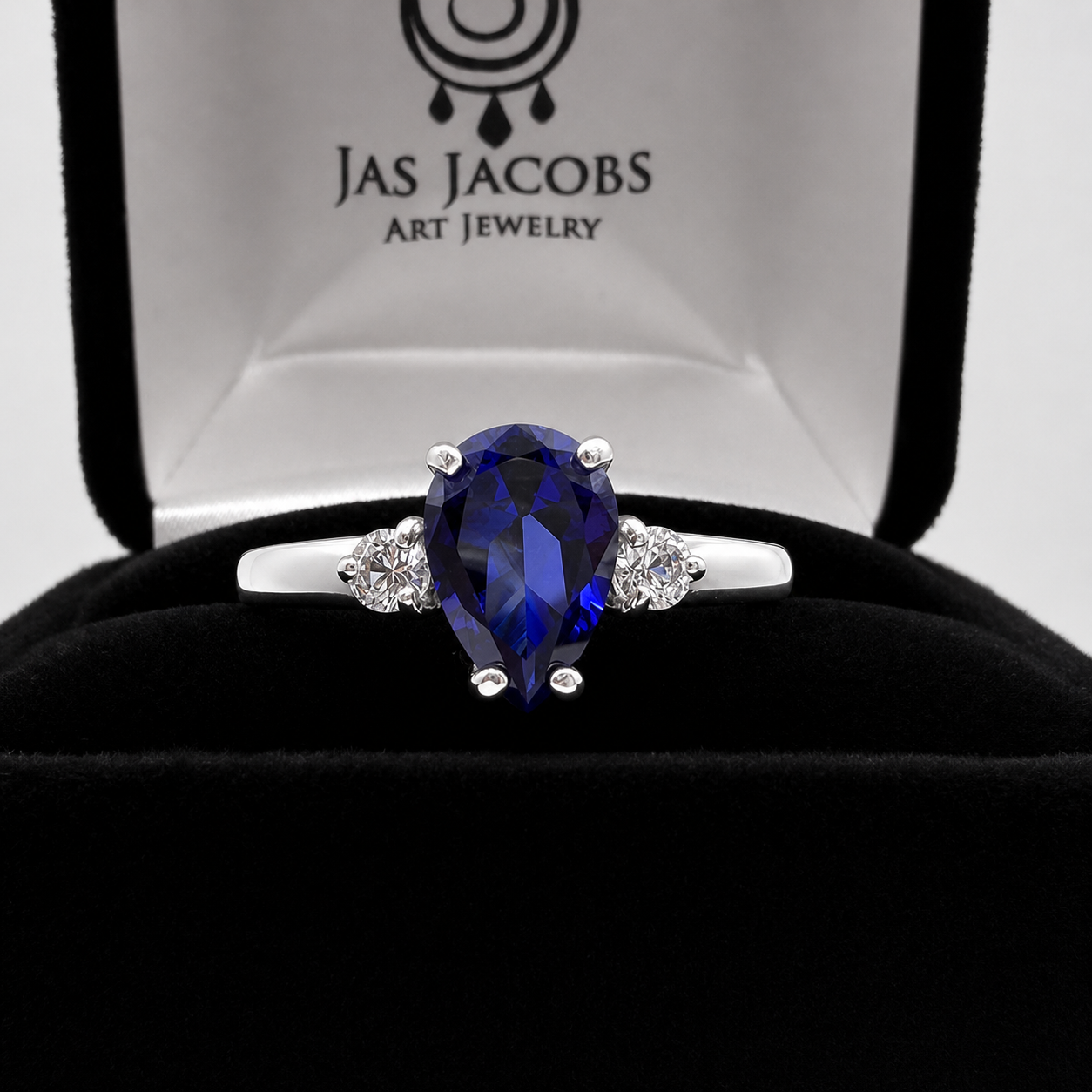 2.5CTW Pear Cut Sapphire Ring with White Sapphire Accents